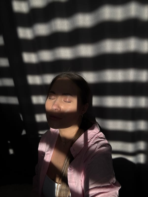 Woman photographed in dramatic sunlight patterns, Chernushka, Russia