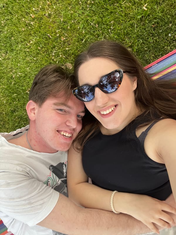 Couple enjoys afternoon hammock time in Bulgarian suburb
