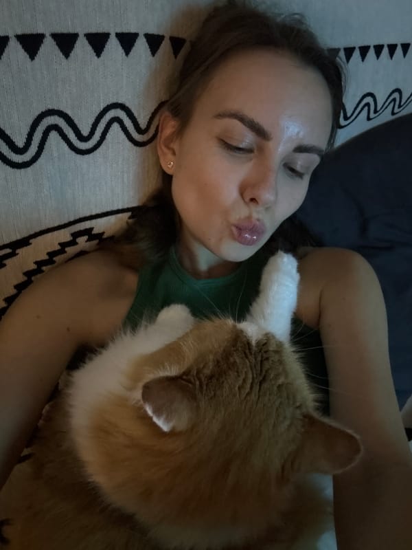 Woman shares quiet moment with cat in Zheleznogorsk home