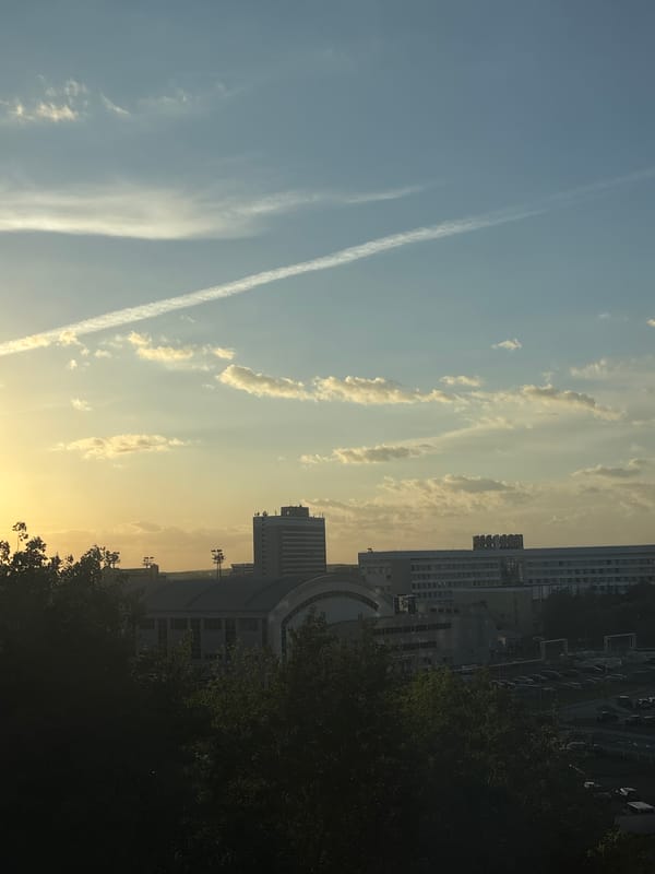 Minsk resident documents personal items and cityscape during evening