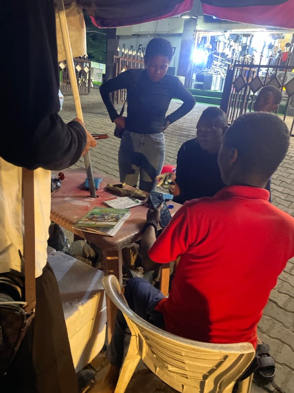Evening street life and barbershops documented across Abuja