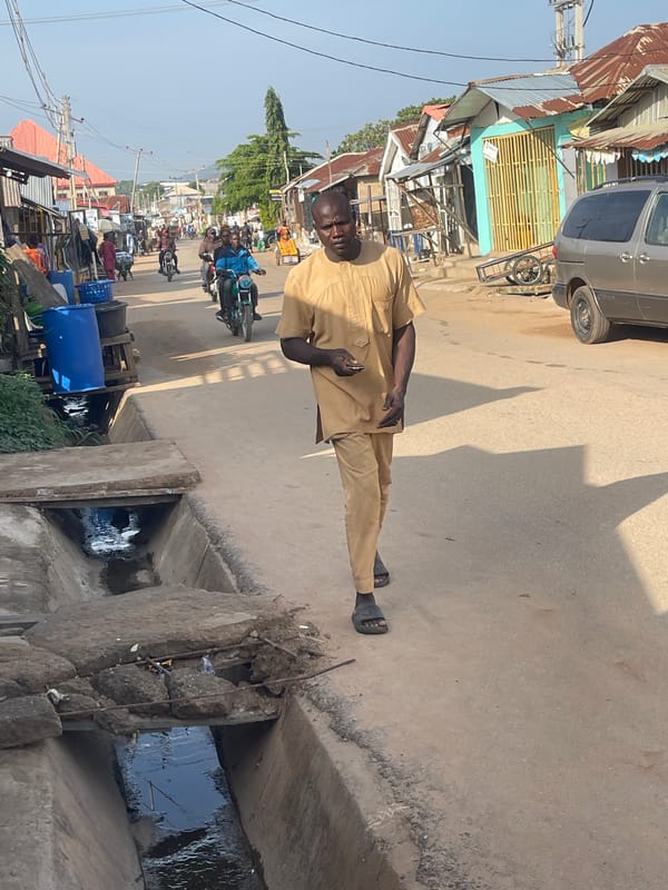 Morning street life documented across Abuja neighborhoods