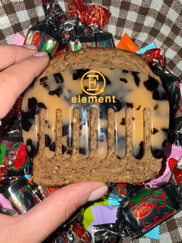Woman with eye sticker holds toy indoors in Votkinsk