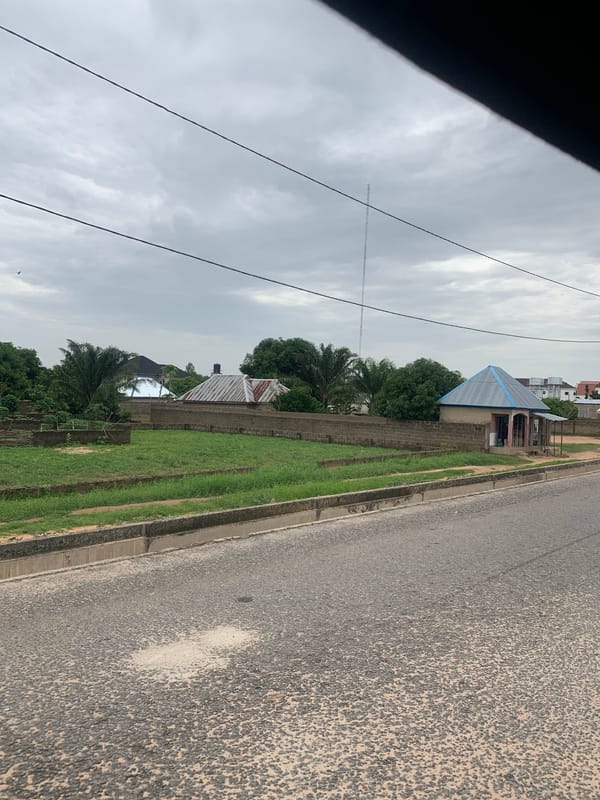 Street-level scenes around a school and event hall in Howayi, Nigeria