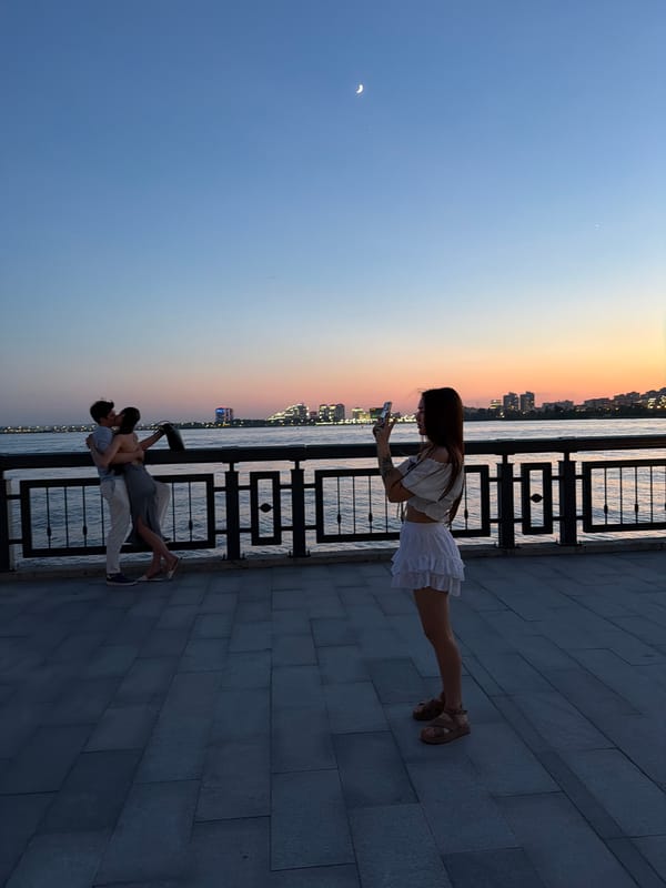 Urban twilight scene with modern buildings and casual interactions
