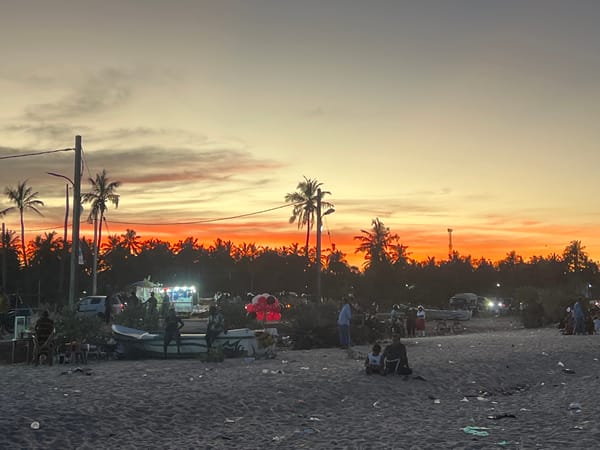 Sunset observed by beachgoers in Kalmunai, Sri Lanka
