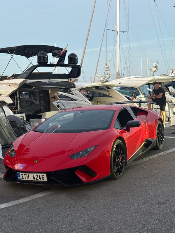 Red Lamborghini, yachts, and evening streets in Puerto Banús