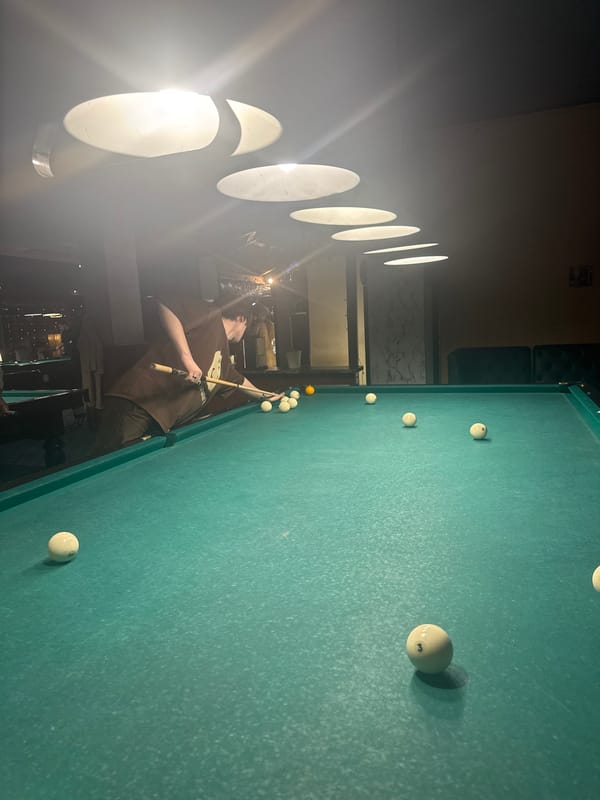 Billiards game captured at Moscow venue during evening hours