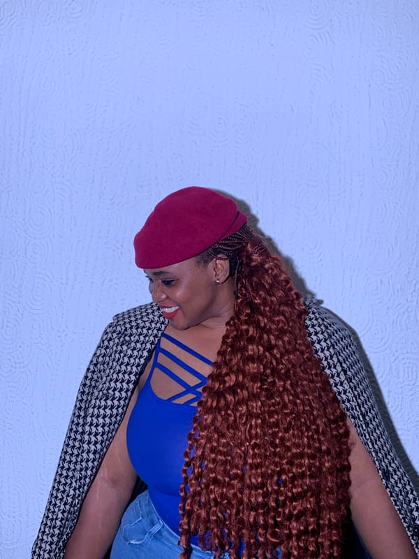 Woman in red beret photographed in Nigeria portrait session