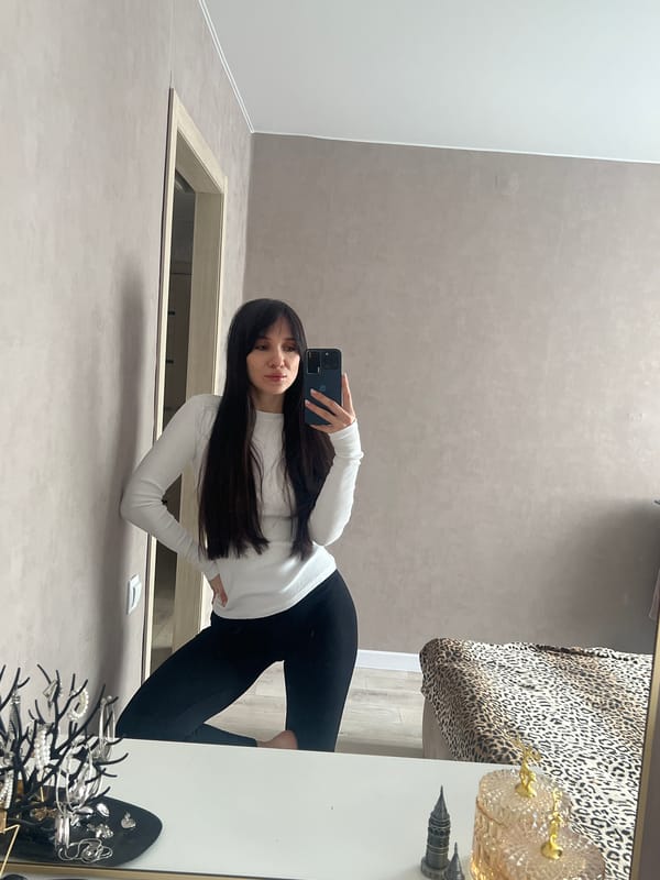 Woman takes mirror selfies in Votkinsk room