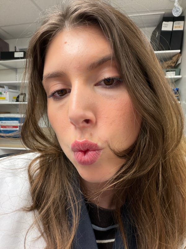 Person makes kissing gesture in Longueuil office setting