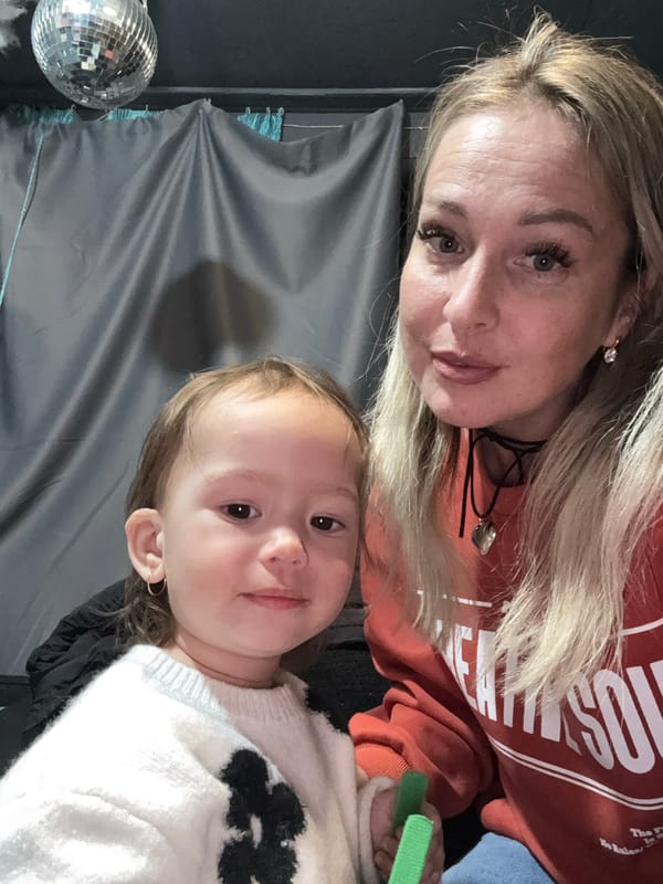 Woman and child pose for indoor photo in Chaikovsky