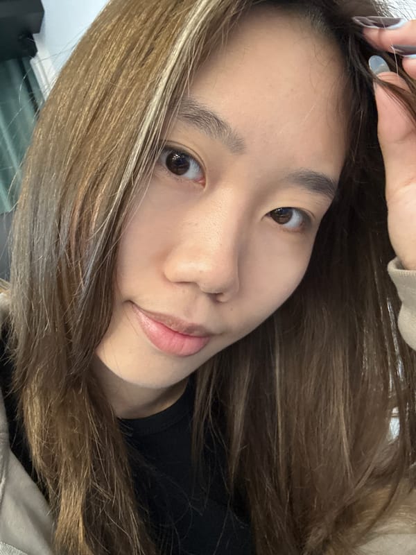 Young woman photographs herself indoors in Nan'an District