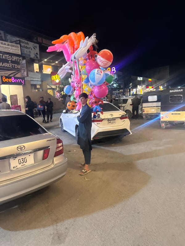Balloon vendor sells branded balloons on Quetta street