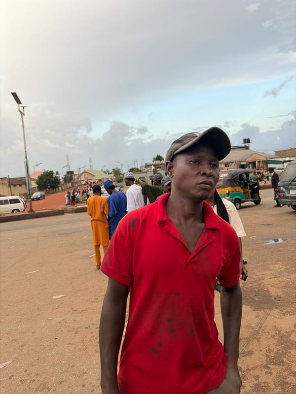 Afternoon street and market activity in Gura Top, Nigeria