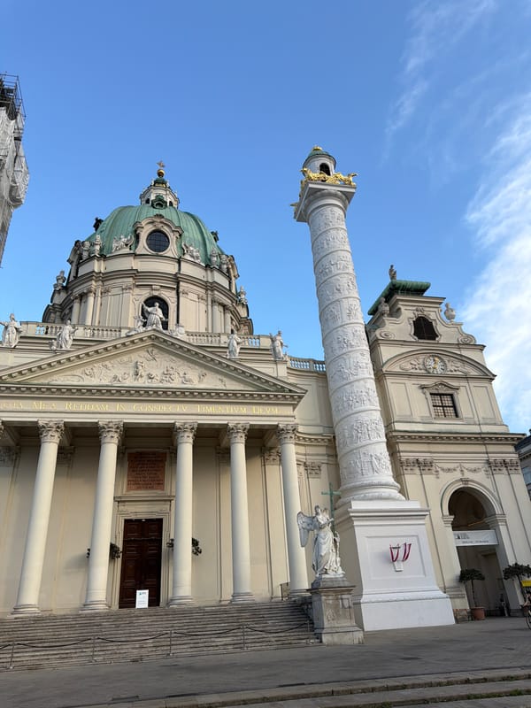 Karlskirche and Plague Column up close on a clear Vienna afternoon
