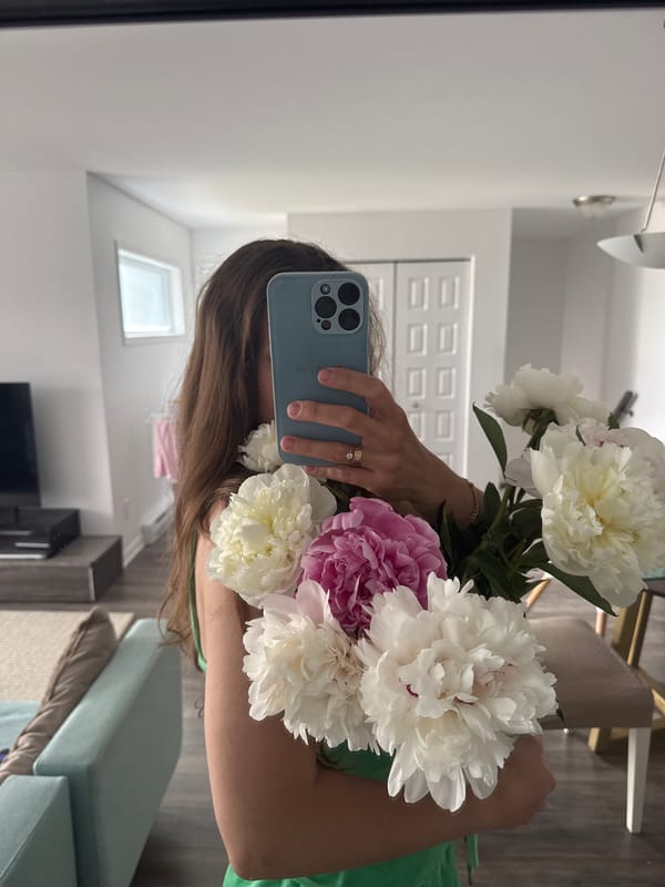 Woman Takes Mirror Selfies with Peony Bouquet in Gatineau