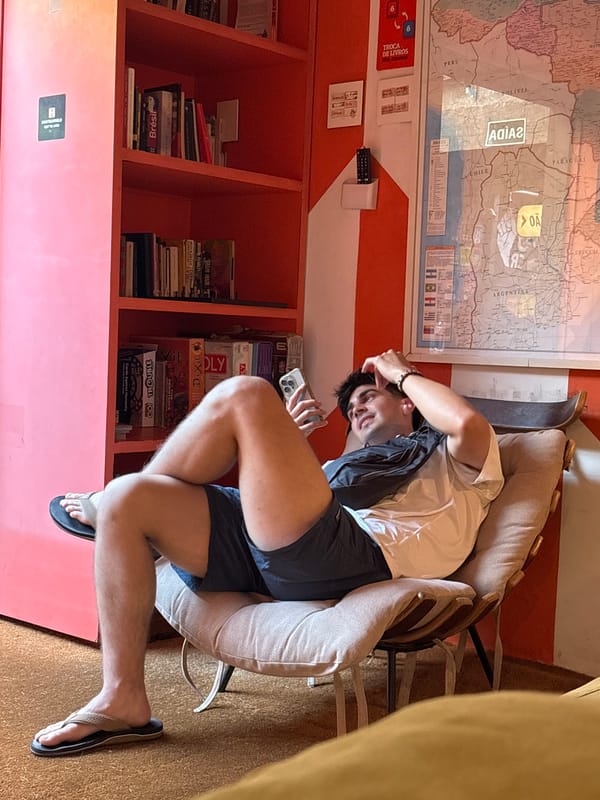 Traveler relaxes in São Paulo hostel common area