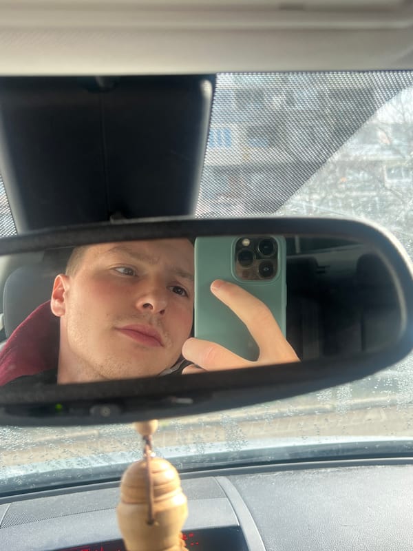 Person takes rearview mirror selfie in Burgas, Bulgaria
