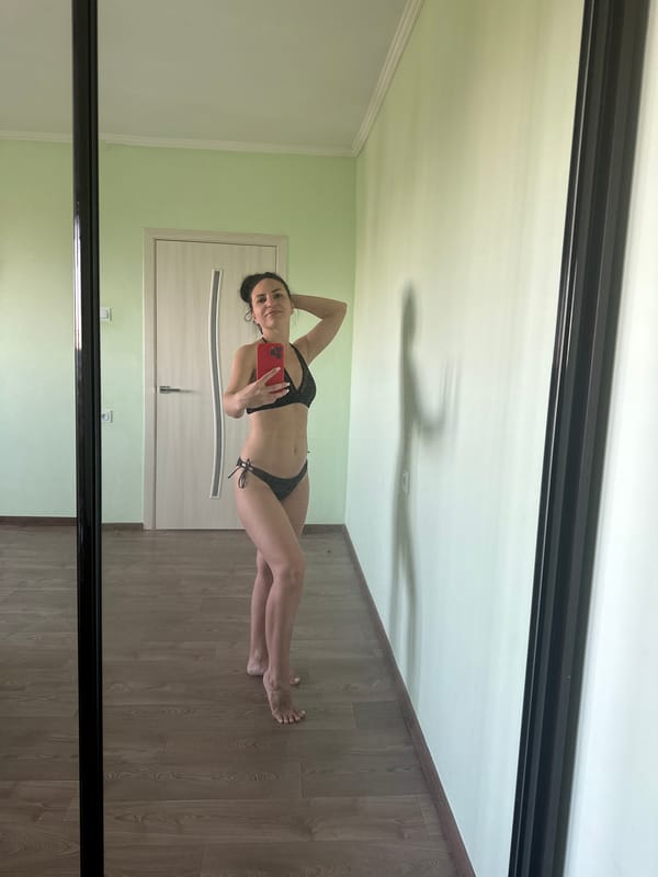 Mirror selfie in a bedroom, black bikini, Odesa