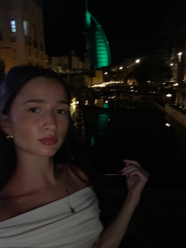 Dubai landmarks glow green during evening photo sessions