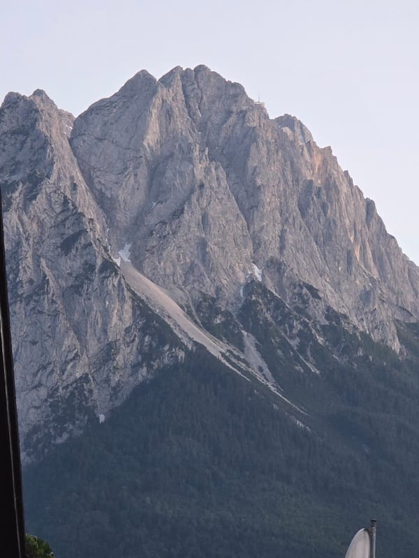Alpine evening walk through Garmisch-Partenkirchen beneath golden Zugspitze peaks
