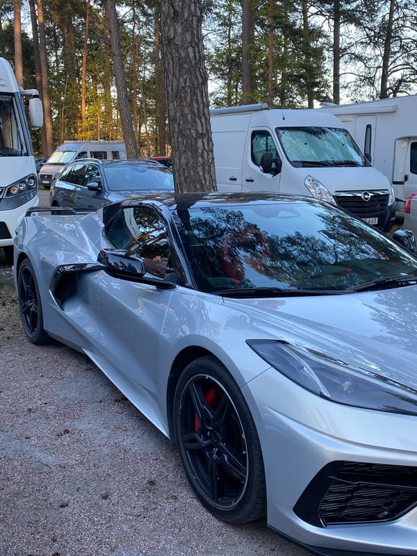 Silver Corvette C8 spotted among RVs in Uppsala parking area