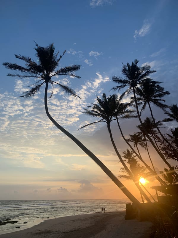 Sri Lankan beachgoers enjoy golden hour sunset at Kathaluwa shores
