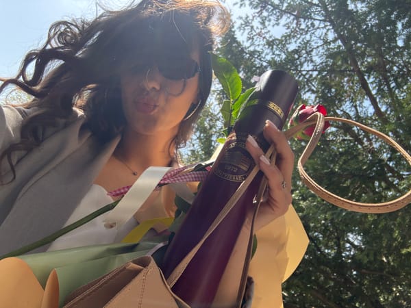 Woman holds university diploma and flowers in Kragujevac