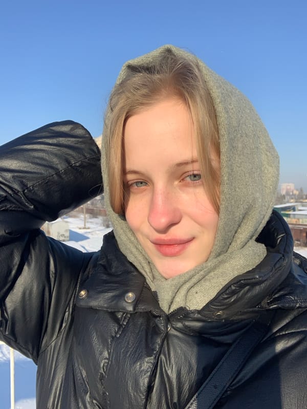 Young woman takes winter selfies in sunny Kyiv
