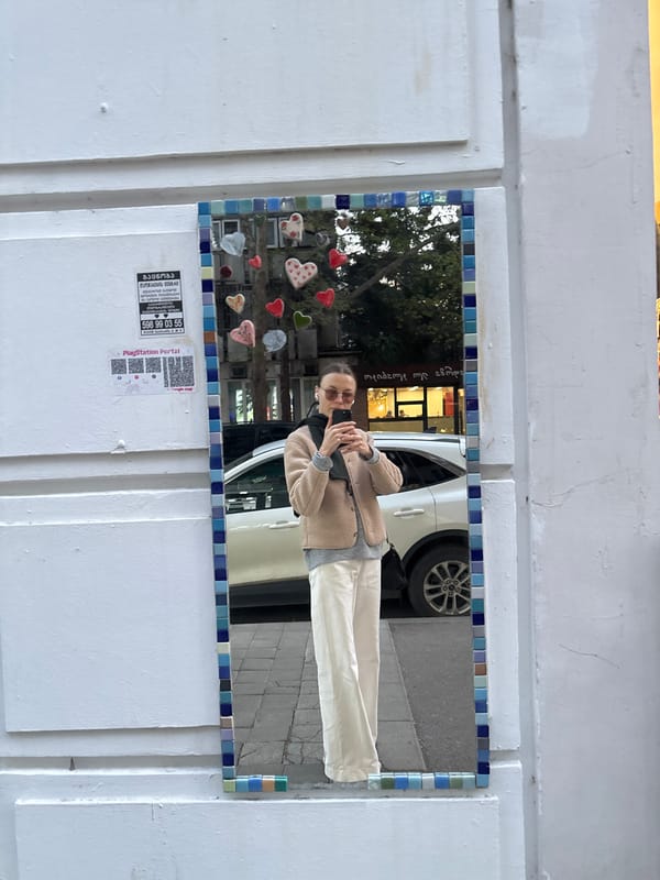 Tourist documents brief walking tour through downtown Tbilisi markets