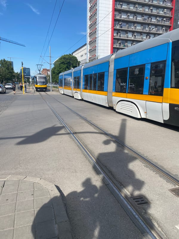 Sofia street scenes captured: tram service, sidewalks, overflowing bins