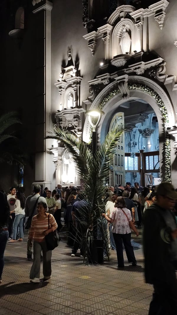 Nighttime crowd gathers at Miraflores church in Peru