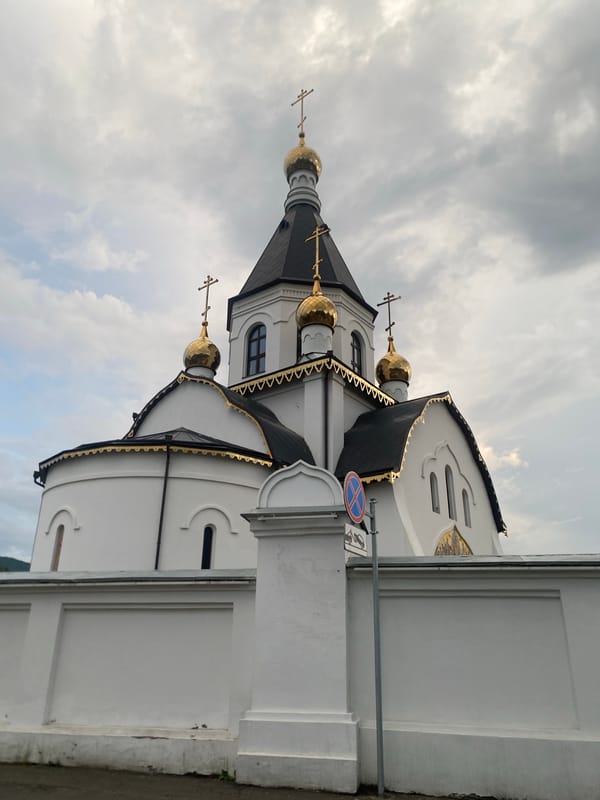 Orthodox church and traditional wooden architecture in Krasnoyarsk
