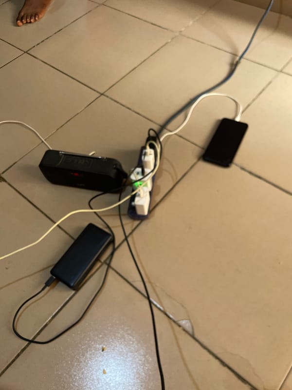 Electronic devices charging, interior scenes captured in Jos area