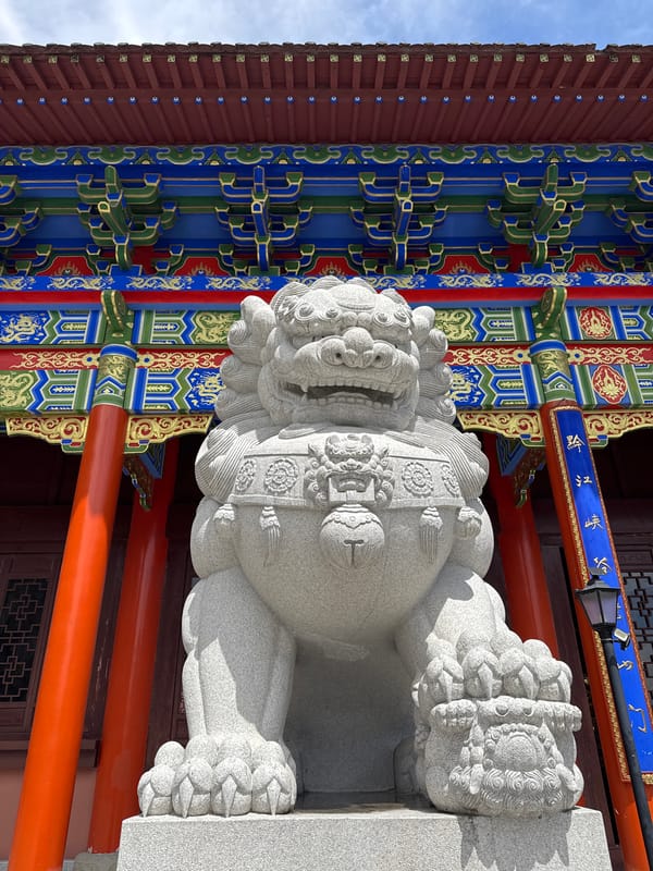Tourist documents traditional temple architecture in Qianjiang, China