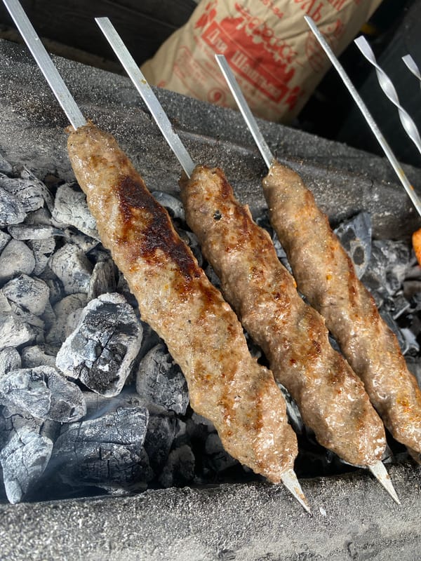 Almaty street life: transit, markets, and grilling kebabs