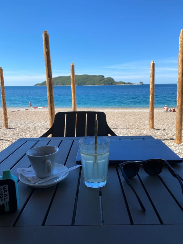 Morning beachfront dining setup captured in Budva, Montenegro
