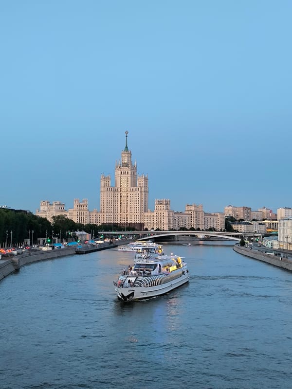 Moscow riverfront at dusk, fountains and city skyline