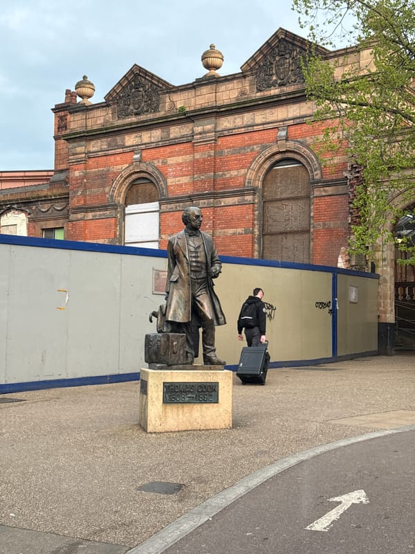 Historic Leicester station building documented under overcast afternoon skies