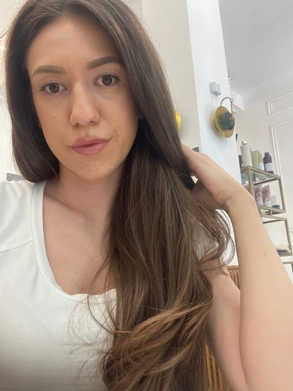 Woman takes selfies in Sofia public restroom facility