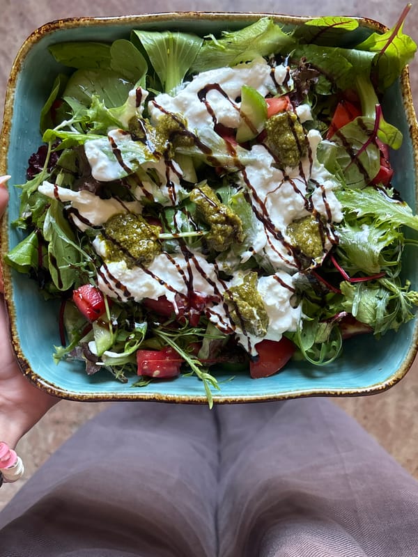 Person enjoys salad lunch in Yerevan, Armenia