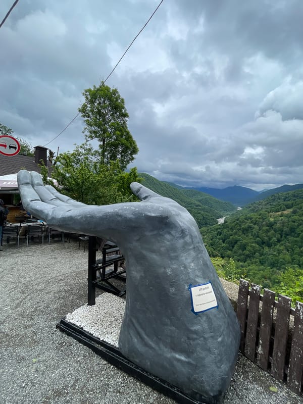 Tourist documents sculpture trail and mountain views in Khartsyz Pervyi