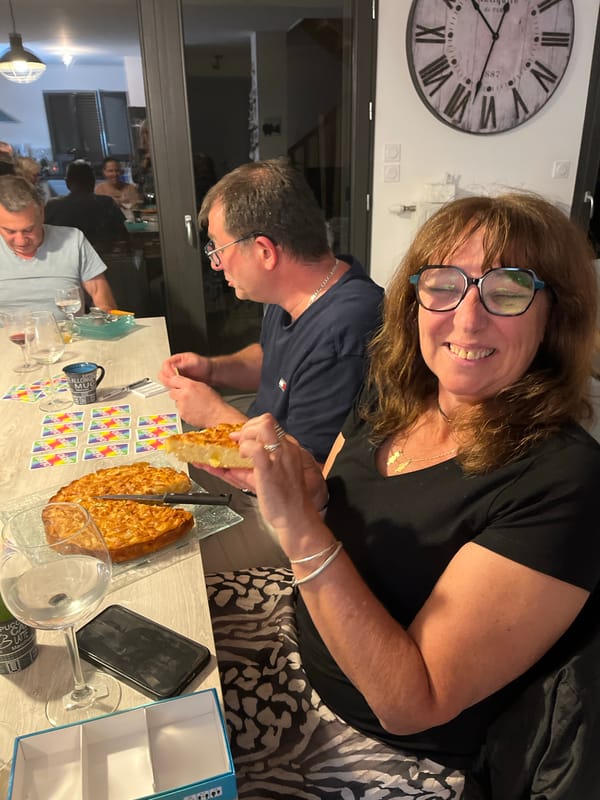Friends gather for game night with cake in Chambœuf