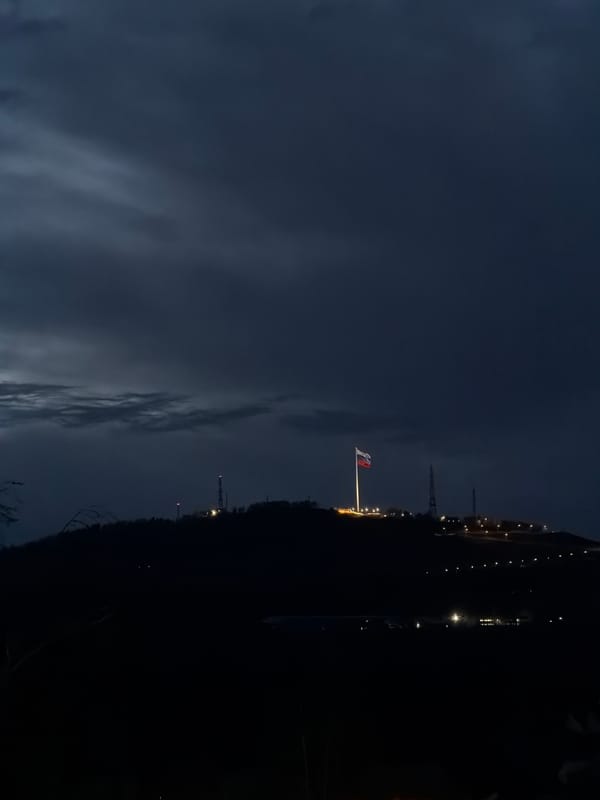 Illuminated Russian flag observed at night in Krasnoyarsk
