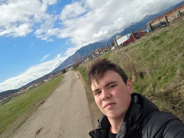 Young man photographed in rural Yahinovo during spring afternoon