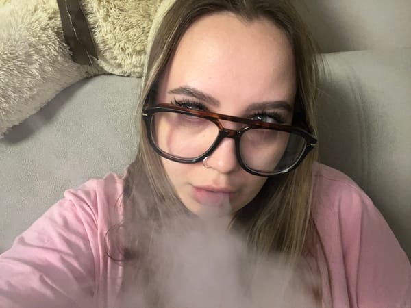Woman smoking on couch observed in Krasnodar, Russia