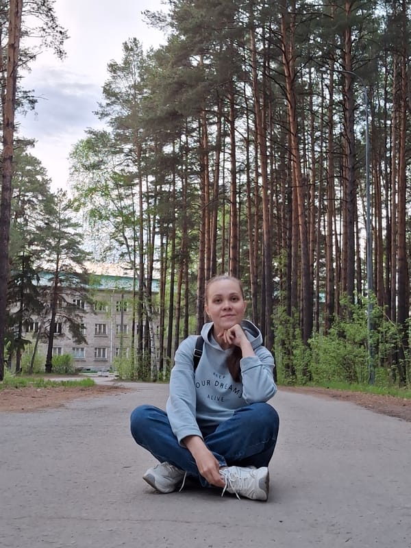 Woman walks forest paths near Chaikovsky, Russia Wednesday afternoon