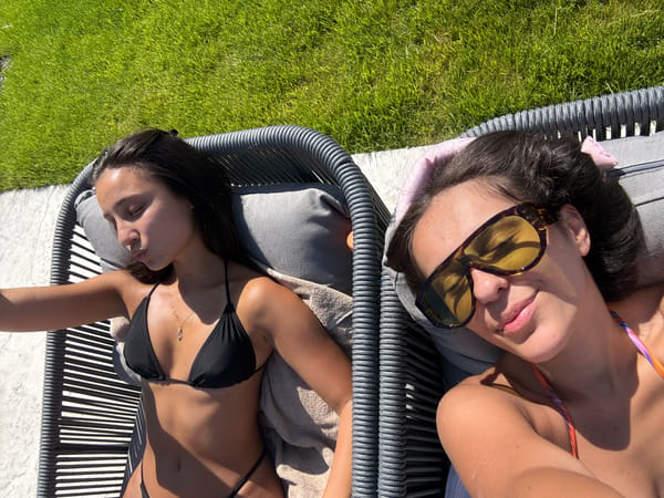 Two women relax poolside in Elenovo, Bulgaria