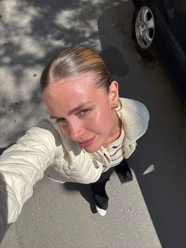 Morning moments captured in Tbilisi: woman, bird amid urban scene